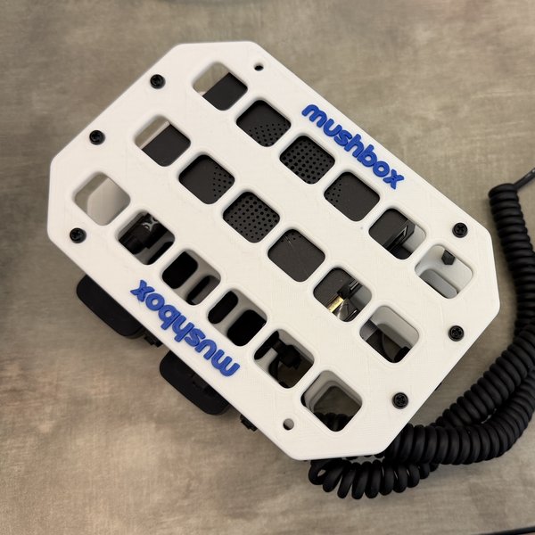 White Mushbox with blue lettering and coiled cable