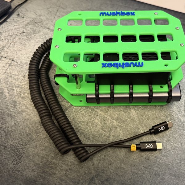 Green Mushbox with blue lettering