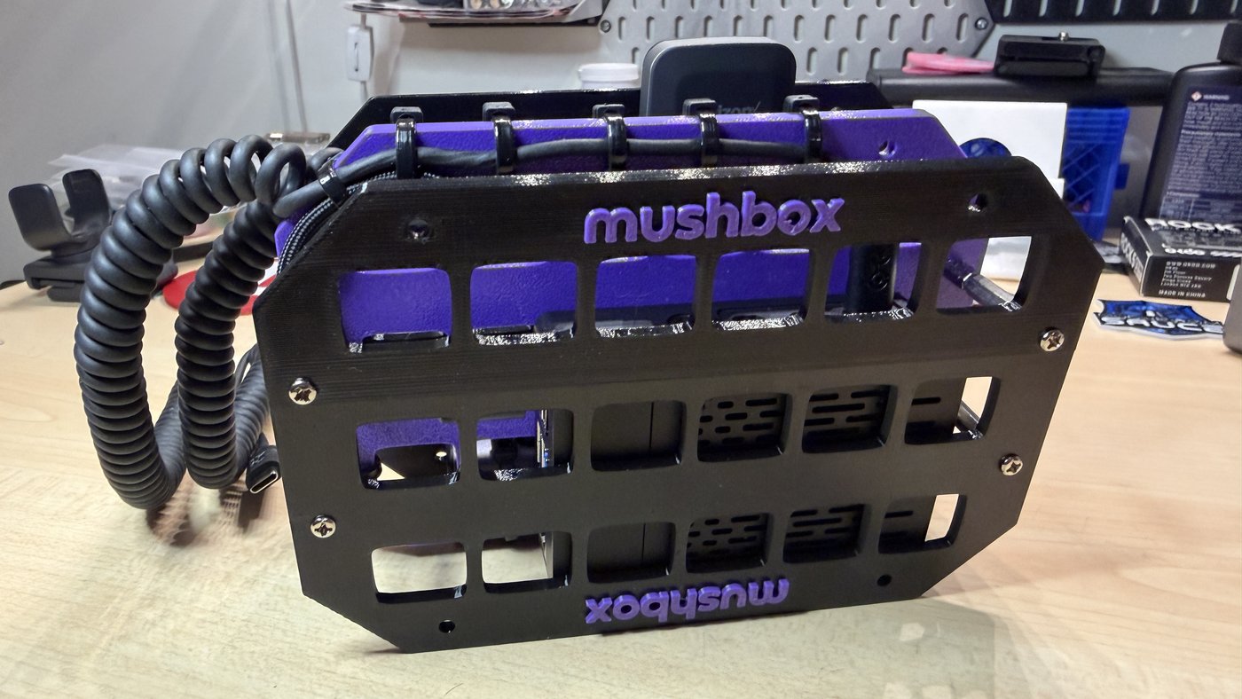 Black and purple Mushbox side profile with cellular dongle on top